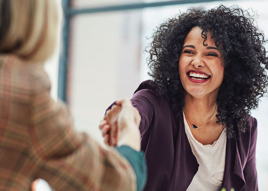 women shaking hands