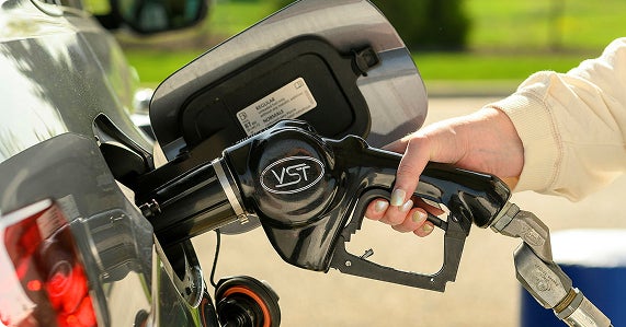 Image of pump fueling a car