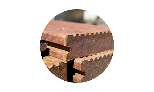 Pile of building materials made from recycled plastic for green building and construction
