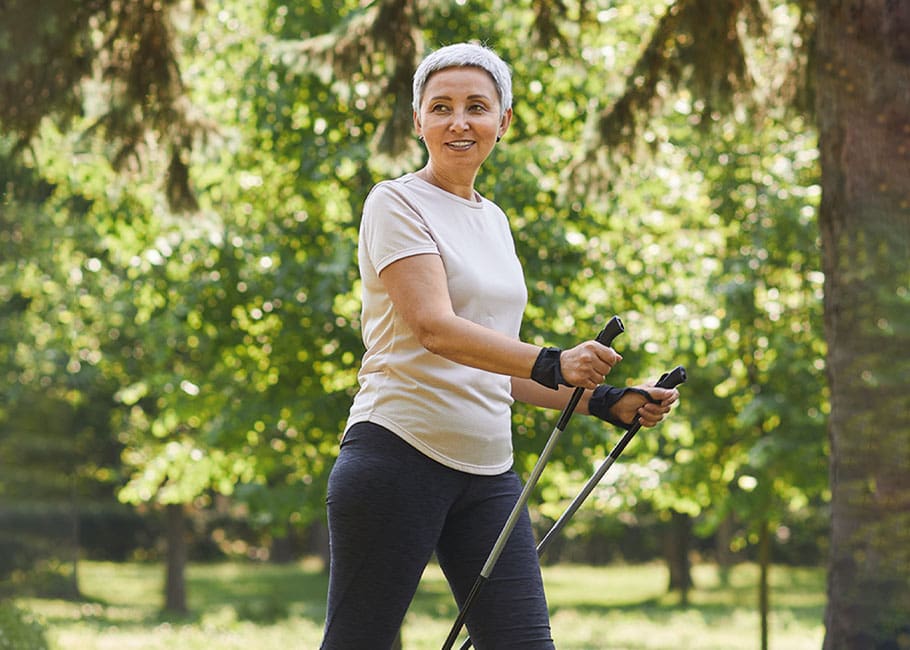 woman walking with walking sticks
