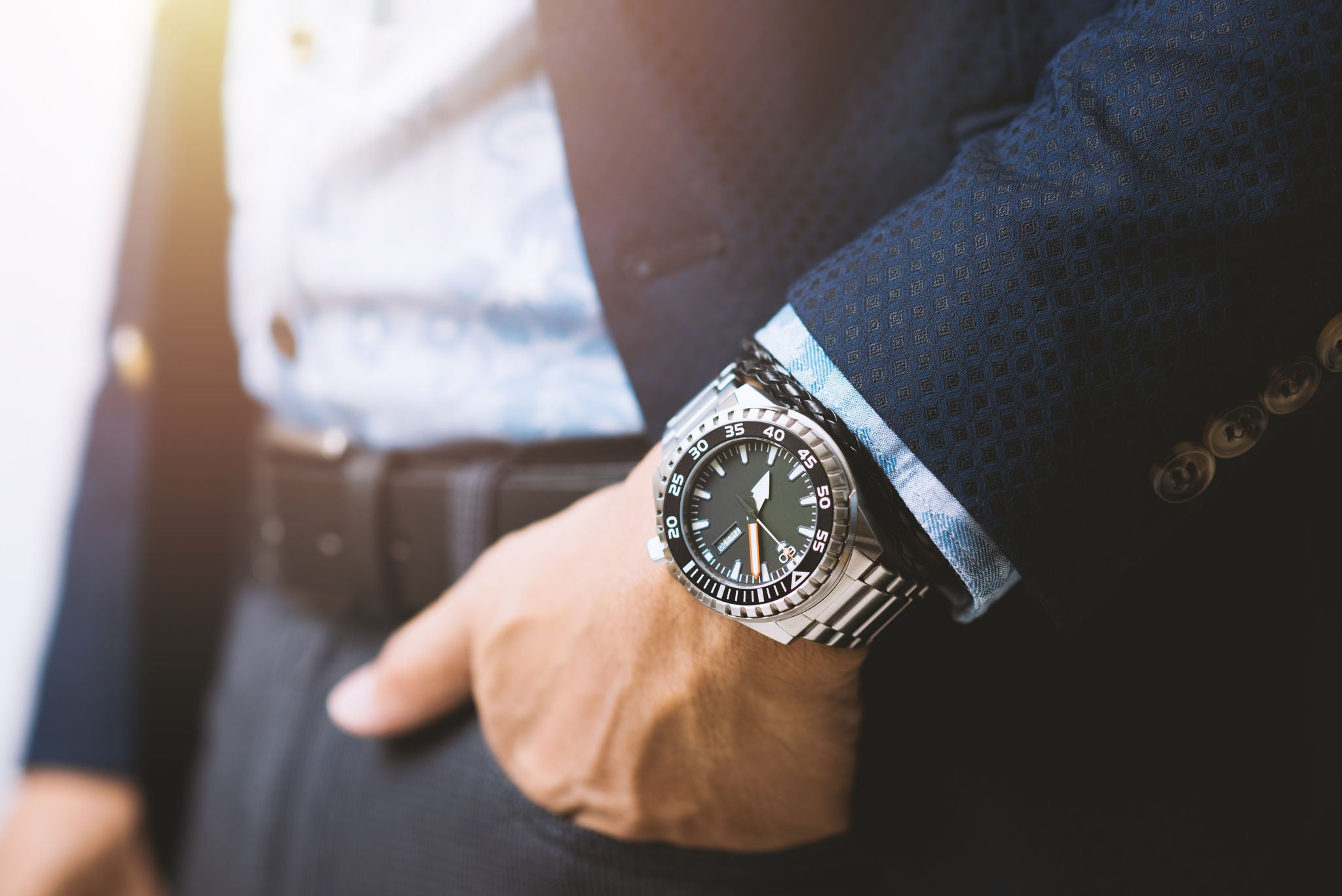 Close-up of a man's hand wearing a wrist watch