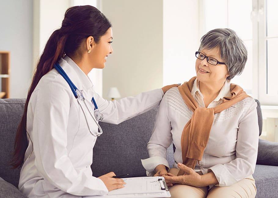 a nurse talking to a woman