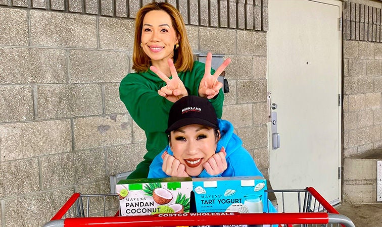 Two women posing with their product