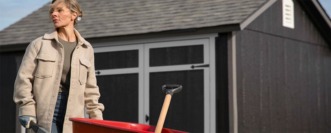 woman wheelbarrow gorilla shed