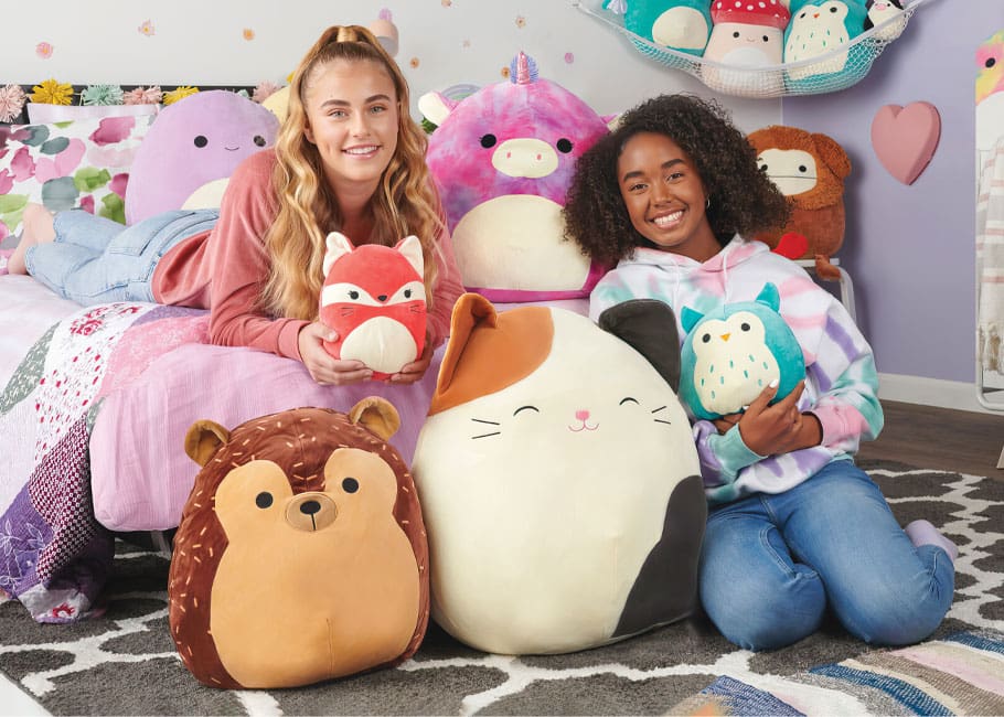 two girls with Squishmallows