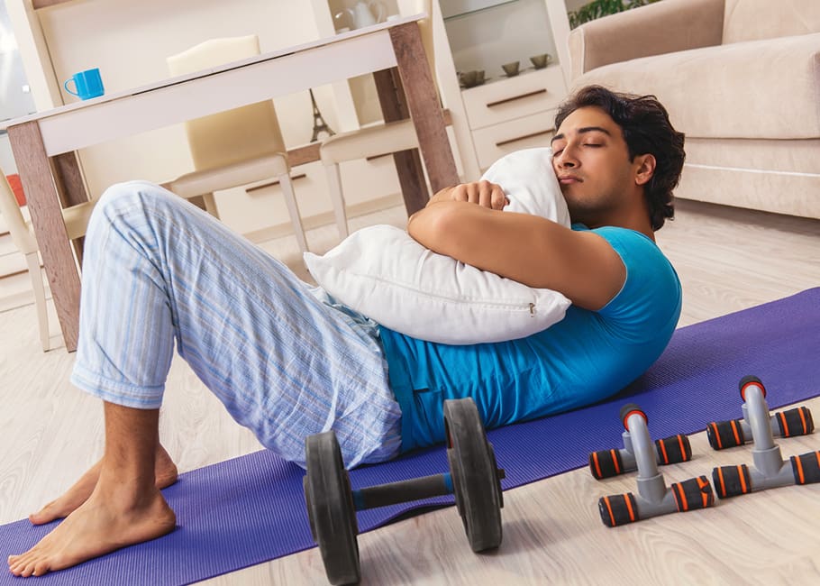 man laying down holding a pillow