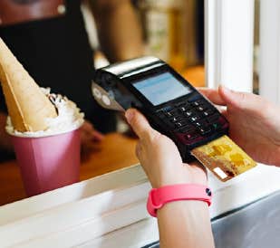 a person using a credit card reader